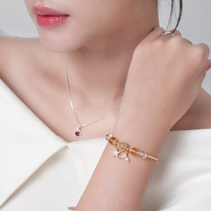 Vòng tay đá An gem đá năng lượng trắng mix vàng kèm charm phụ kiện phong thuỷ đeo tay